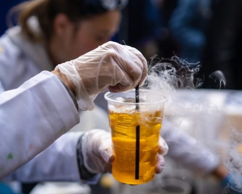 Multicolored alcoholic and non-alcoholic cocktails with straws